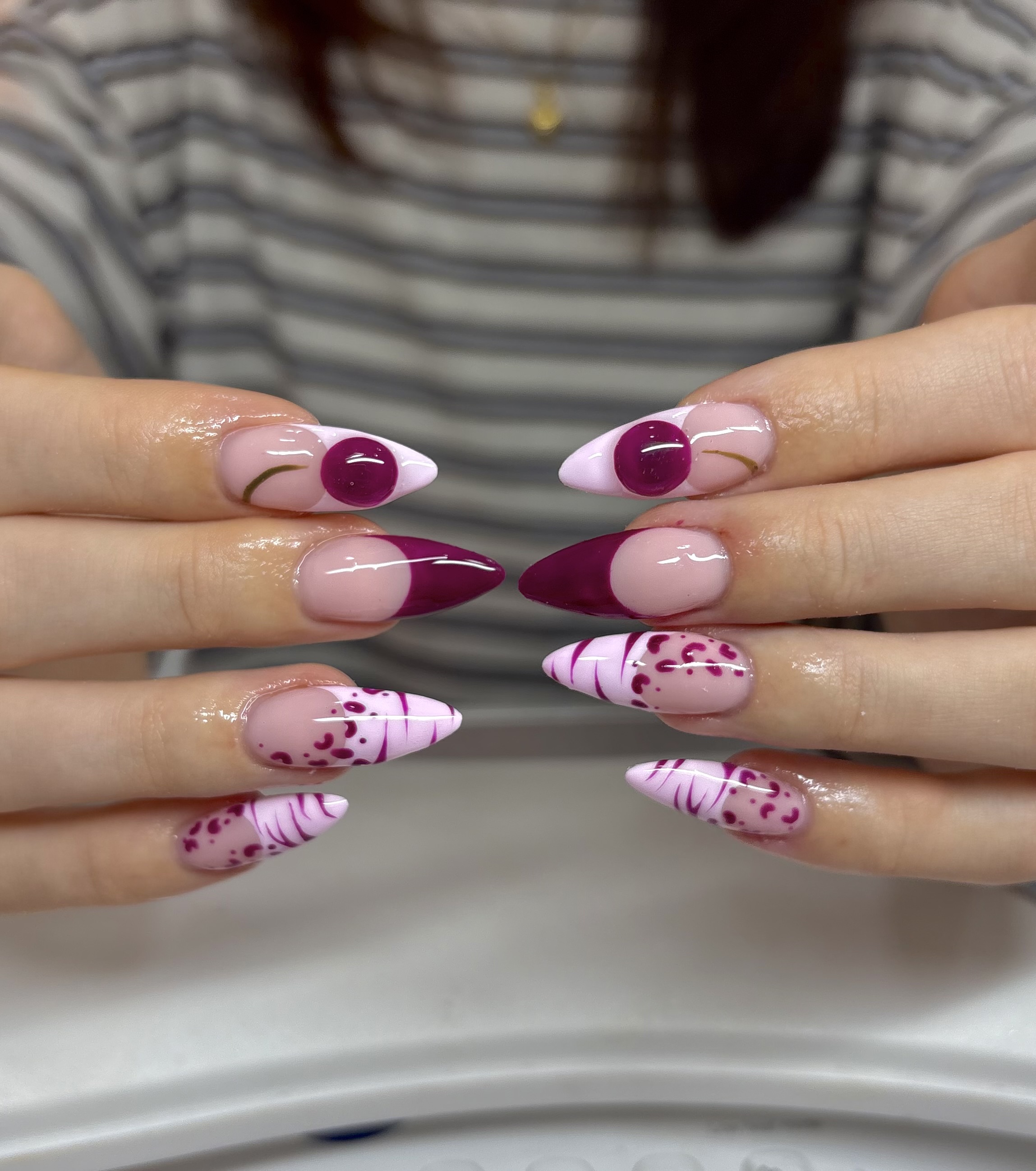 Almond builder gel extensions with berry and pink nail art